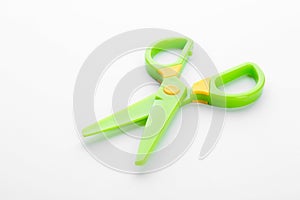 Colorful plastic scissors on white background.