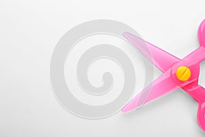 Colorful plastic scissors on white background.