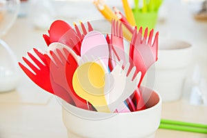 colorful plastic spoon and fork