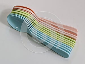 Colorful plastic spoon on isolated background