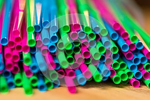 Colorful plastic straws close up, concept of ban act for plastic packaging in Europe 2019, with free space for your text