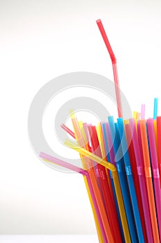colorful plastic straws in a cup