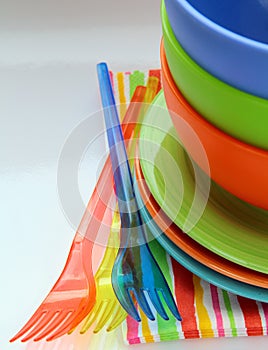 Colorful plastic tableware and napkins