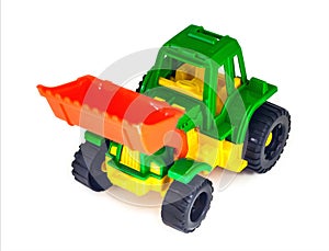Plastic toy wheeled tractor loader excavator, isolated