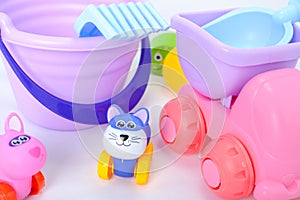 Colorful plastic and wooden toys in baby room