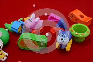 Colorful plastic and wooden toys in baby room