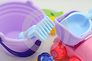 Colorful plastic and wooden toys in baby room