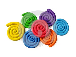 Colorful spiral plasticine, rainbow colored clay dough, white background