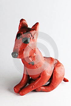 Colorful Plasticine or Clay Dog, created by hands