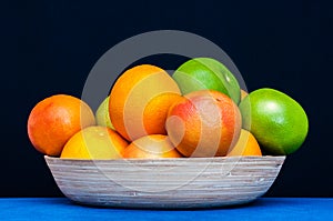 Colorful plate full of Citruses fruits. Oranges, grapefruits.