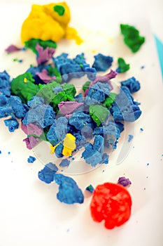 Colorful playdough balls on the table.