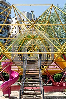 Colorful Playground Structure with Slides and Climbing Frames