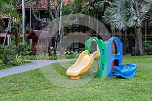 Colorful playground on yard in the garden at resort hotel