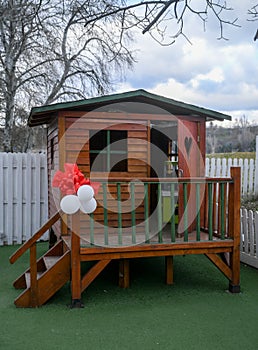 Colorful playground on yard in public park. Children`s play house in a yard. Outdoor player for children at playground