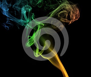 Colorful plume smoke isolated on black background.