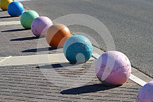 Colorful poles and curbs along the sidewalk in a big city in Israel