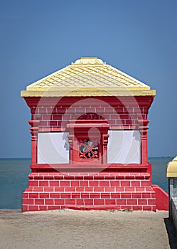 Colorful police outpost at lands end on South East boundary of India at Dhanushkodi. Text in local language is the translation of