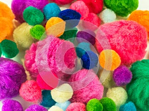 Colorful pom poms DIY craft supplies photo