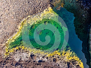 Colorful ponds on Playa de Echentive on La Palma island. View from above