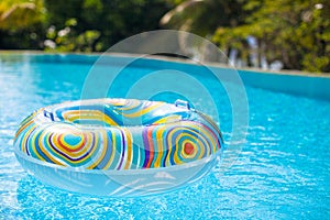 Colorful pool float in blue swimming basin