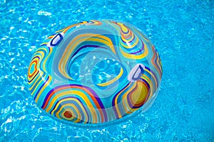 Colorful pool float in blue swimming basin