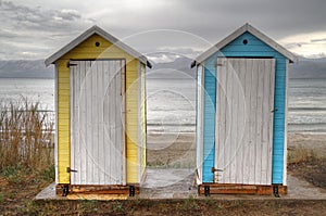 Colorful portable toilet houses on beach