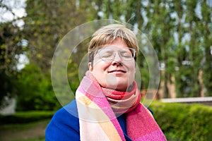 Colorful portrait of a 38 yo white woman with short hair, eyes closed, Brussels, Belgium