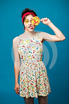 Colorful portrait young funny fashion girl posing on blue