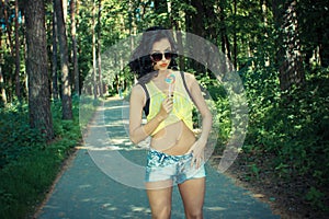Colorful portrait of young funny fashion girl posing in summer style outfit