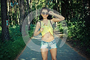 Colorful portrait of young funny fashion girl posing in summer style outfit