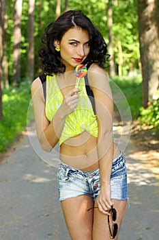 Colorful portrait of young funny fashion girl posing in summer style outfit