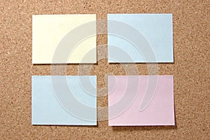 Colorful post-it notes on corkboard