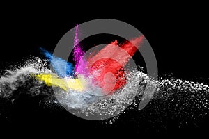 Colorful powder explosion on black background.