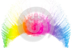 Colorful powder explosion on white background.Colored dust particle splash.Painted Holi