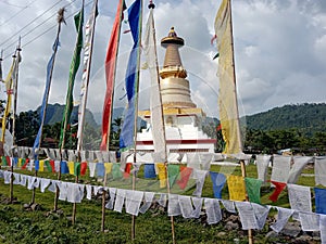 Colorful Prayer Flags Flutter Amid Giant Buddhist Stupa