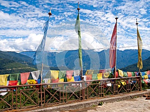 Colorful prayer flags over a clear blue sky in Bhutan