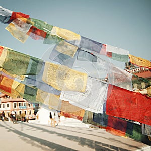 Colorful praying flags newr Boudhanath Stupa - vintage filter.