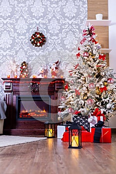 Colorful presents under Christmas tree in decorated room