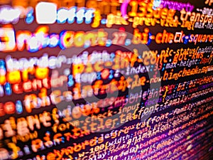 Colorful programming php and html code on a monitor. Abstract source code background. Script on computer with source code.