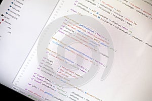 Colorful programming php and html code on a monitor.