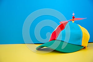 A colorful propeller hat on a background