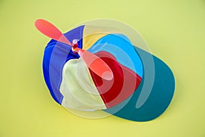 A colorful propeller hat on a background