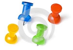 Colorful push pins set with shadows isolated on