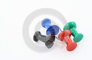 Colorful pushpins on white