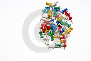 Colorful pushpins on white background