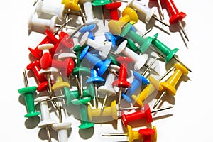 Colorful pushpins on white background