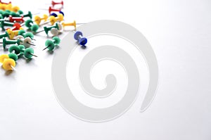 Colorful pushpins on a white background