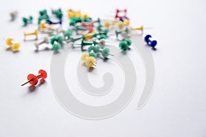 Colorful pushpins on a white background