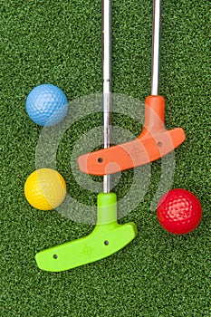 Colorful Putt Putt clubs and Balls