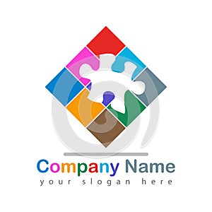 Colorful puzzle piece logo on white photo